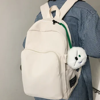 Женщины Простой нейлоновый рюкзак с комком шерсти Черная белая сумка для школьных книг для девочек-подростков 2024 Симпатичный рюкзак Sac A Dos